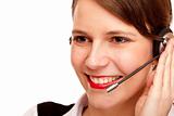 Woman with headset laughs happy and makes a call