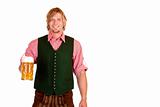 Bavarian man with leather trousers (lederhose) holds oktoberfest beer stein in hand