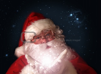 Santa holding magical christmas lights in hands