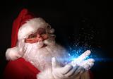 Santa holding magical lights in hands
