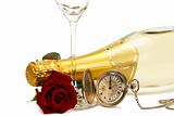 wet red rose under a champagne bottle with a old pocket watch and a empty champagne glass