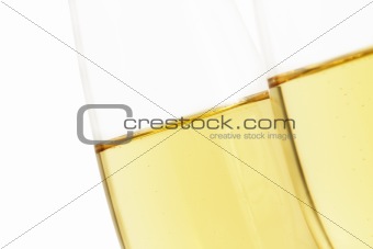 diagonal champagne glass behind other