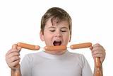 Boy with appetite bites sausages