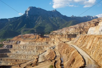 Erzberg iron mine with mountains.