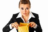 Interested modern business woman checking parcel
