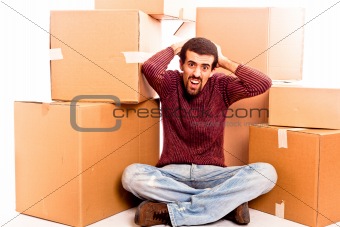 Stressed Young Man Swamped with Boxes