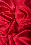 Smooth elegant red silk as background 