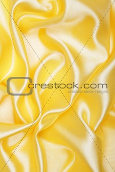 Smooth elegant golden silk as background 