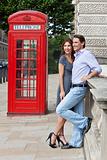 Romantic Couple by Traditional Red Phone Box in London, England