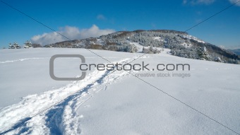 Path in snow leading to top of the mountain