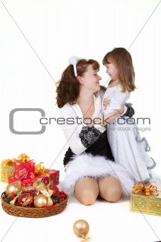 Mother with daughter and christmas toys