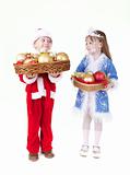 Little girl and boy in christmas clothes with toys