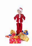 Boy in christmas clothes with presents