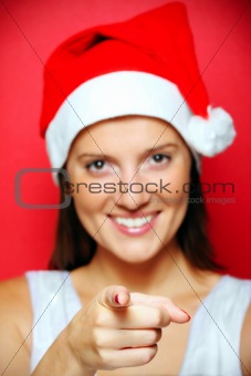 Blurry Santa's helper pointing at you