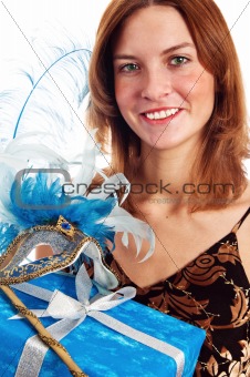  Portrait of the young woman in a carnival to a mask, a close up