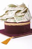 master's cap with a dollars