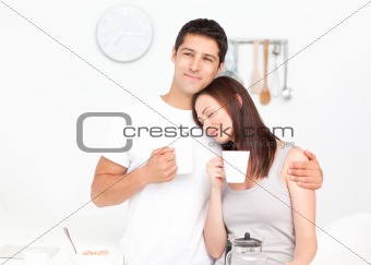 Lovely couple drinking coffee during breakfast