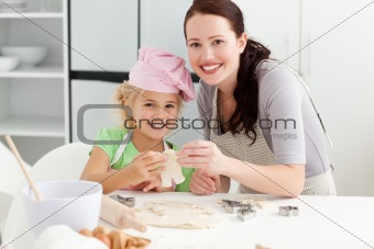 Mother and daughter showing a biscuits to the camera