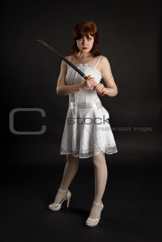 Beautiful girl armed with sword