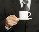 Coffee cup in hand, a businessman - need a break