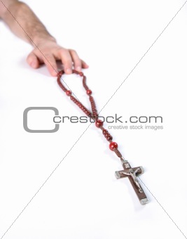 the Christian beads and human hand 