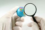 Earth globe & human hand 