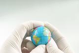 Earth globe in hand