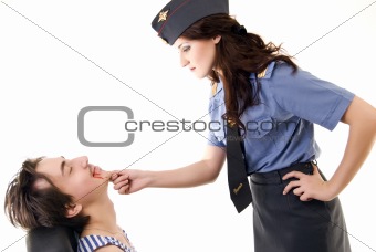 Young woman in police uniform and a criminal