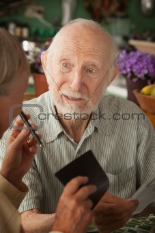 Senior couple with many bills