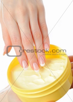 Beautiful hands with perfect nail french manicure and cream