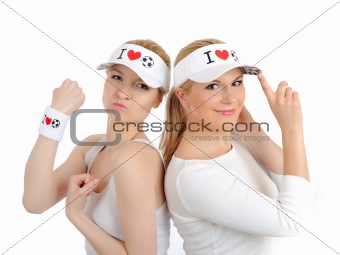 Two pretty football fan girls in funny hats