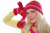 Seasonal portrait of pretty funny woman in hat and gloves