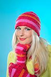 Seasonal portrait of pretty funny woman in hat and gloves
