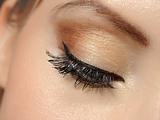 Beautiful macro shot of eye with long lashes and make-up