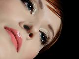 Beautiful macro shot of blue woman eyes with long lashes