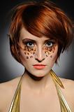 Beautiful red heaired woman with creative trendy make-up