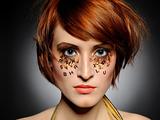 Beautiful red heaired woman with creative trendy make-up