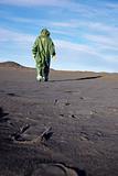 Scientific ecologist in overalls in desert