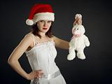 Young woman in Christmas cap holds a rabbit