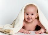 Baby Peeking From Under Blanket
