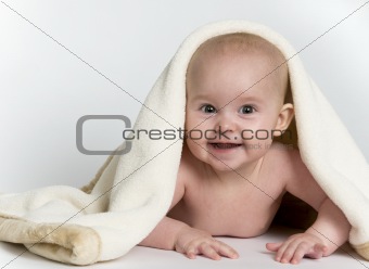 Baby Peeking From Under Blanket