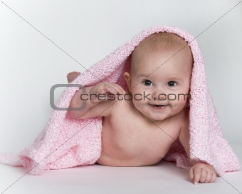 Baby Peeking From Under Pink Blanket