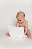 Happy Baby Playing with Mini Laptop