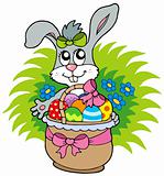 Easter bunny with eggs in basket
