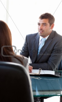 Rear view of a businesswoman talking with a charismatic business