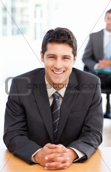 Happy businessman during an interview with a colleague