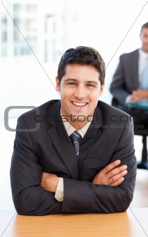 Delighted businessman in the foreground during a meeting 