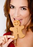 Biting a Gingerbread cookie