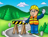 Construction worker standing on road