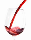 red wine pouring into glass; isolated on white background;